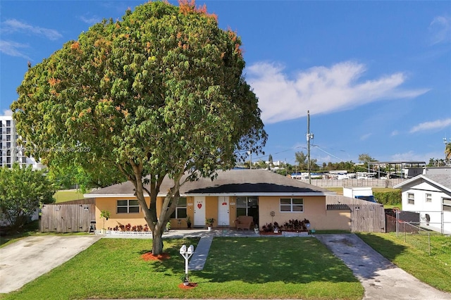 ranch-style house with a front lawn