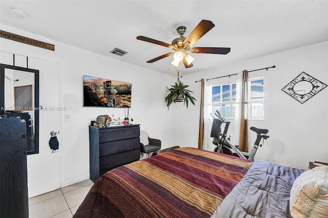 tiled bedroom with ceiling fan