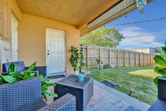 exterior space featuring a yard, central AC, and a patio