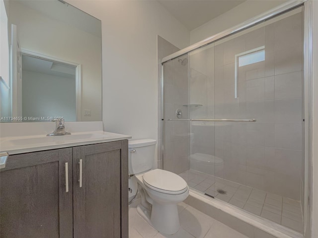 bathroom with walk in shower, vanity, toilet, and tile patterned flooring