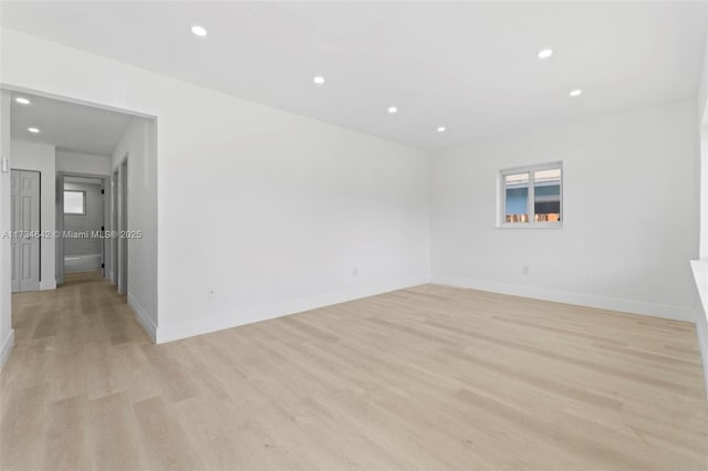 unfurnished room with light hardwood / wood-style floors