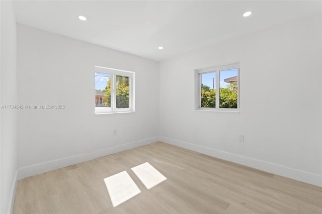 spare room with light hardwood / wood-style floors