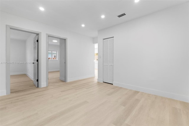 spare room featuring light hardwood / wood-style flooring