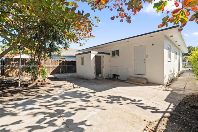 rear view of house with a patio