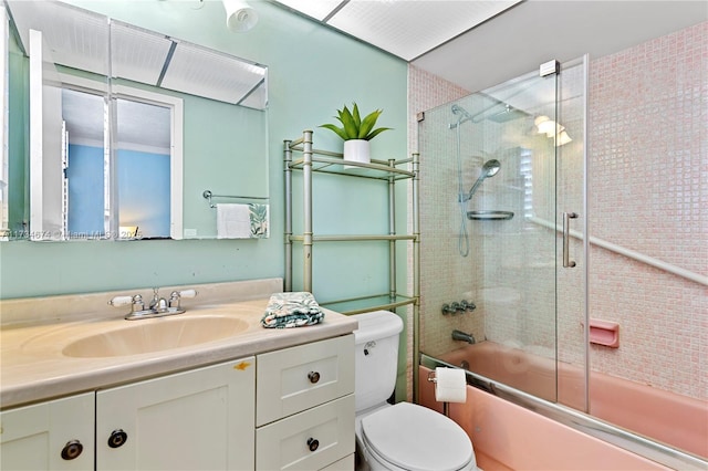2851 Somerset Dr Unit 415, Lauderdale Lakes, FL 33311 - bathroom with toilet, vanity, and bath / shower combo with glass door