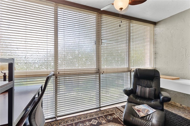 2851 Somerset Dr Unit 415, Lauderdale Lakes, FL 33311 - sitting room with a textured wall and ceiling fan