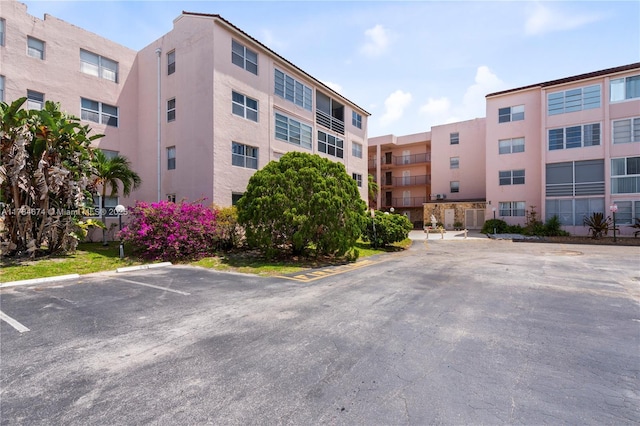 2851 Somerset Dr Unit 415, Lauderdale Lakes, FL 33311 - view of apartment building / complex featuring uncovered parking and central AC