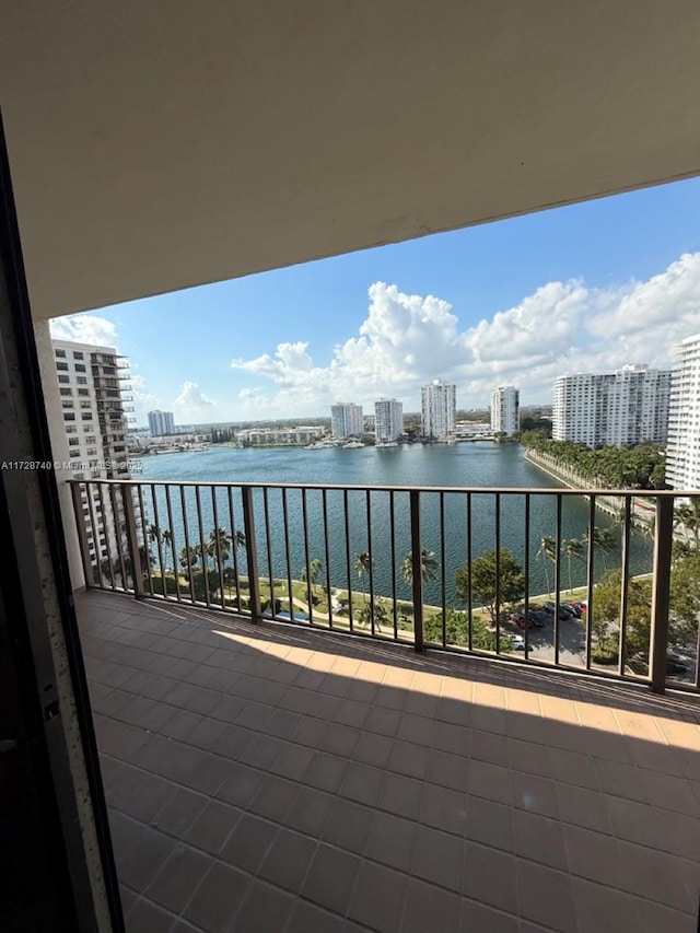 balcony featuring a water view