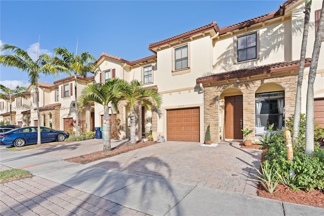 mediterranean / spanish house featuring a garage