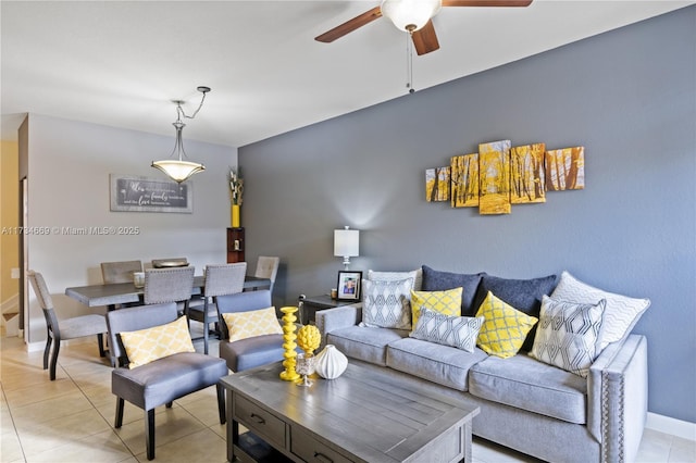 tiled living room with ceiling fan