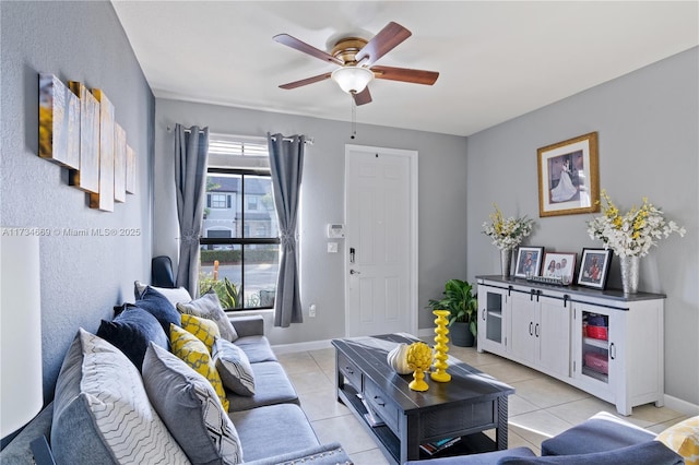 tiled living room featuring ceiling fan