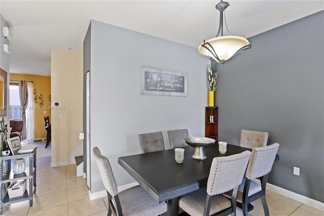 dining area featuring light tile patterned floors