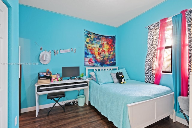 bedroom featuring dark hardwood / wood-style flooring