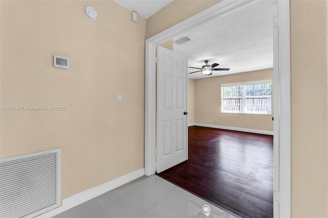 corridor with tile patterned floors