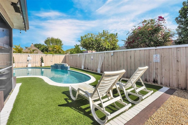 view of pool with a lawn