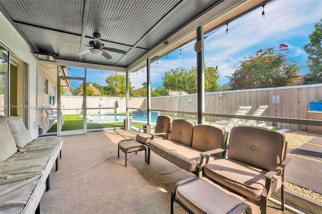 sunroom with ceiling fan