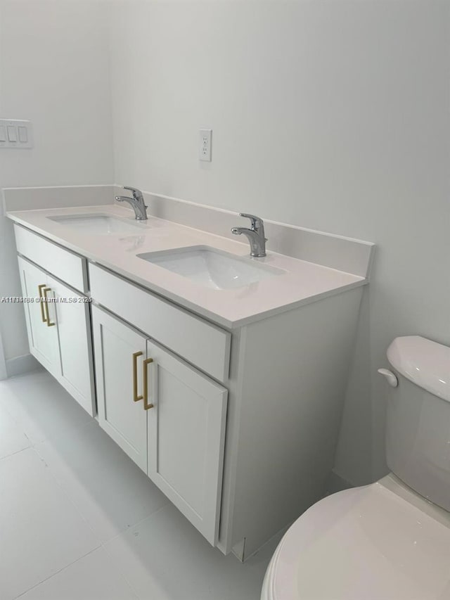 bathroom with vanity and toilet