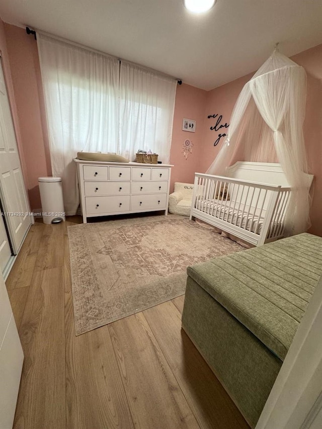 bedroom with wood-type flooring