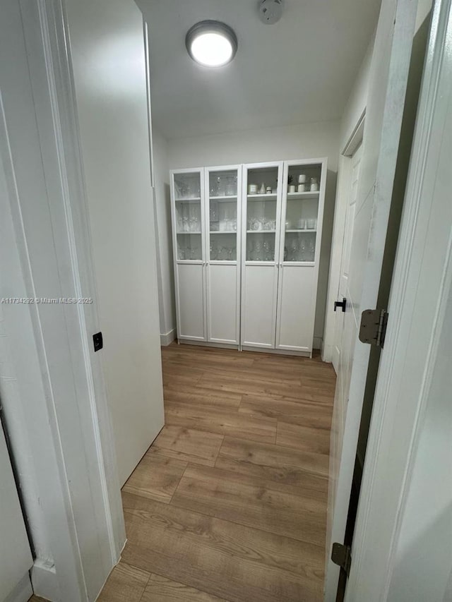 corridor featuring light hardwood / wood-style floors