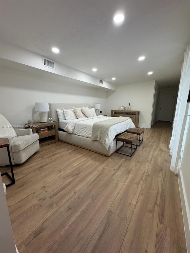 bedroom featuring light hardwood / wood-style floors