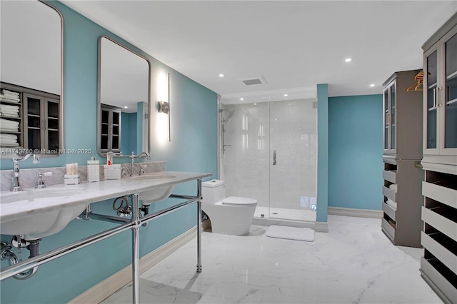 bathroom featuring recessed lighting, marble finish floor, toilet, and a shower stall