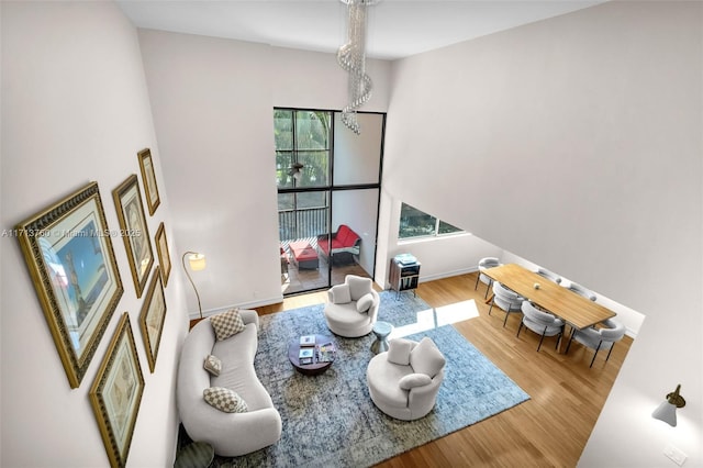 living room with baseboards and wood finished floors