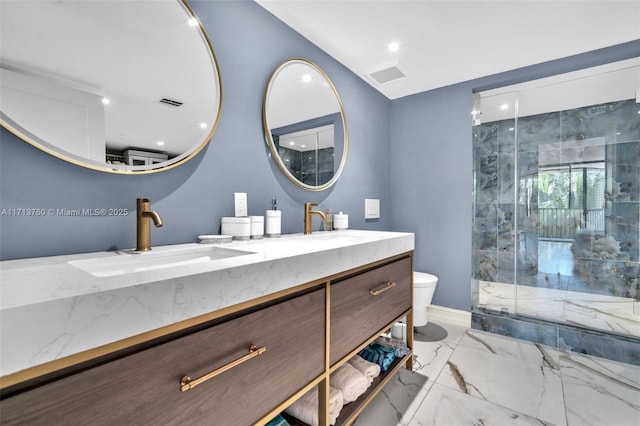 bathroom with a shower stall, toilet, marble finish floor, and a sink