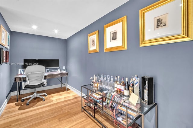 office area with recessed lighting, baseboards, and wood finished floors