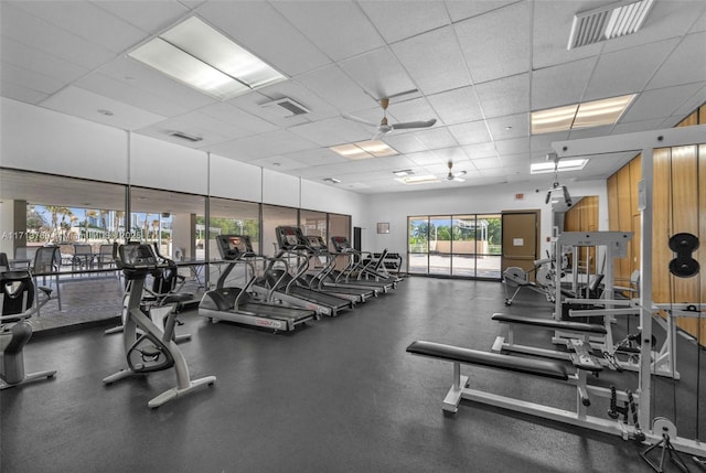 workout area with a paneled ceiling and visible vents