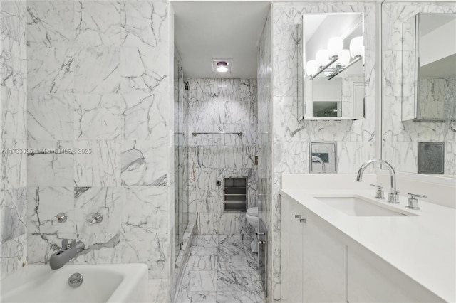 bathroom featuring vanity, tile walls, and toilet