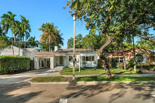 view of front of house with a front lawn