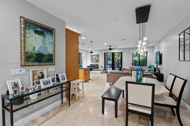 dining space featuring a notable chandelier