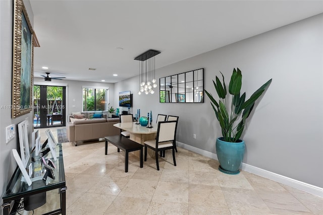 dining area with an inviting chandelier