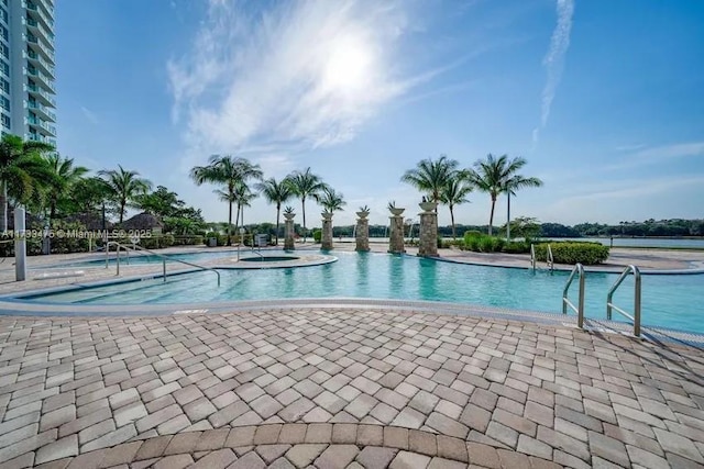 view of pool featuring a hot tub