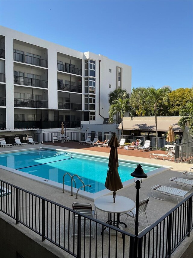 view of swimming pool with a patio