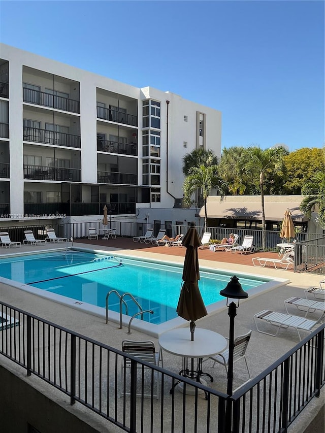 view of swimming pool with a patio