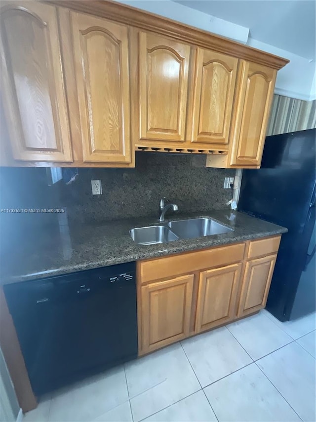 201 178th Dr Unit 309, Sunny Isles Beach, FL 33160 - kitchen with tasteful backsplash, dark stone countertops, light tile patterned floors, black appliances, and a sink