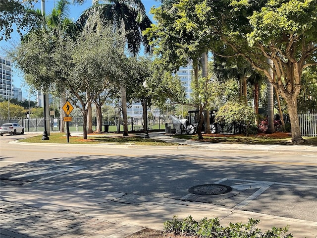 201 178th Dr Unit 309, Sunny Isles Beach, FL 33160 - view of road featuring traffic signs, sidewalks, and curbs