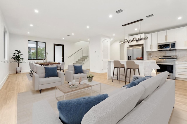 living room with light hardwood / wood-style floors