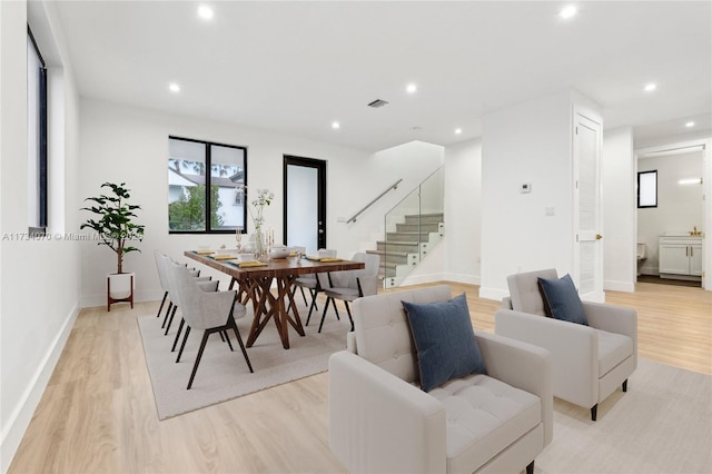 dining area with light hardwood / wood-style floors