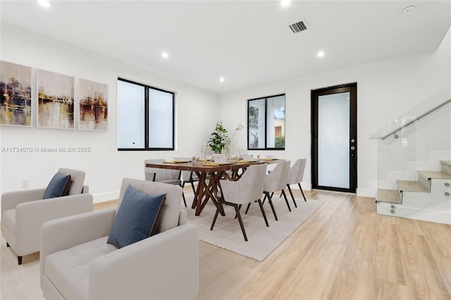 dining space featuring light hardwood / wood-style floors