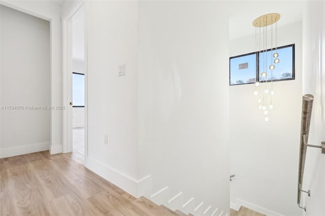 hall with light hardwood / wood-style flooring