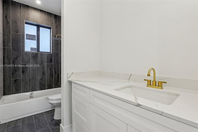 full bathroom with vanity, toilet, and tiled shower / bath combo