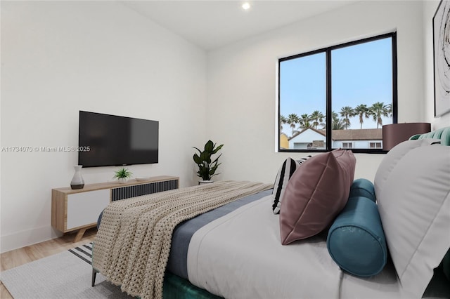 bedroom with wood-type flooring