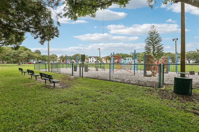 view of home's community with a yard and a playground