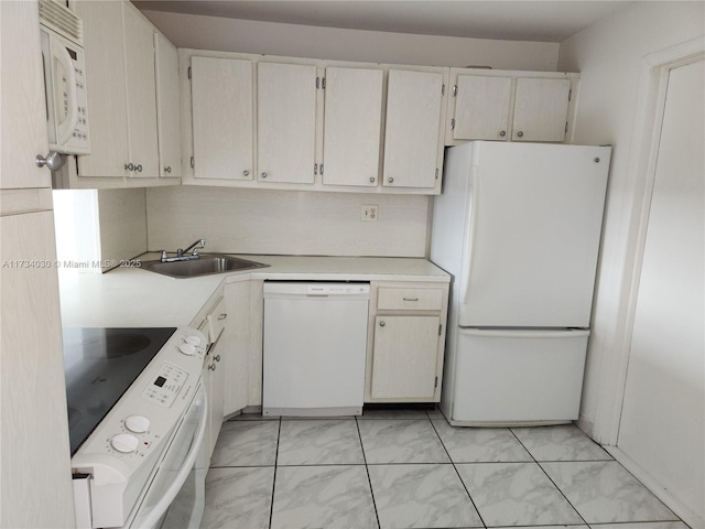 kitchen with white appliances and sink