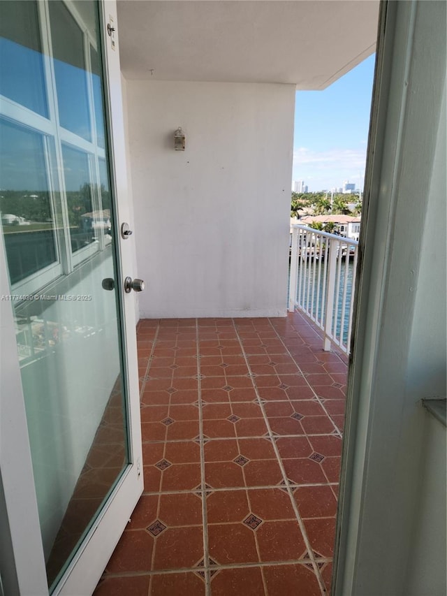 balcony featuring a water view