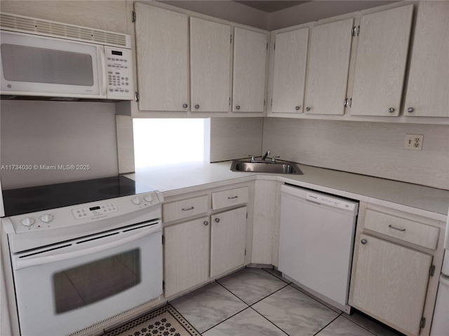 kitchen with sink and white appliances