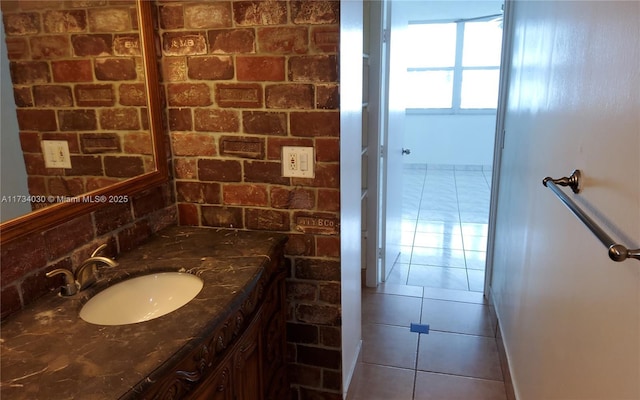 bathroom with tile patterned floors and vanity