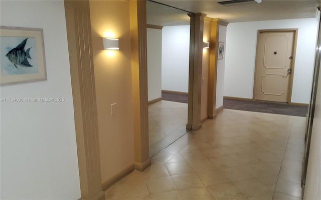 hallway featuring ornate columns